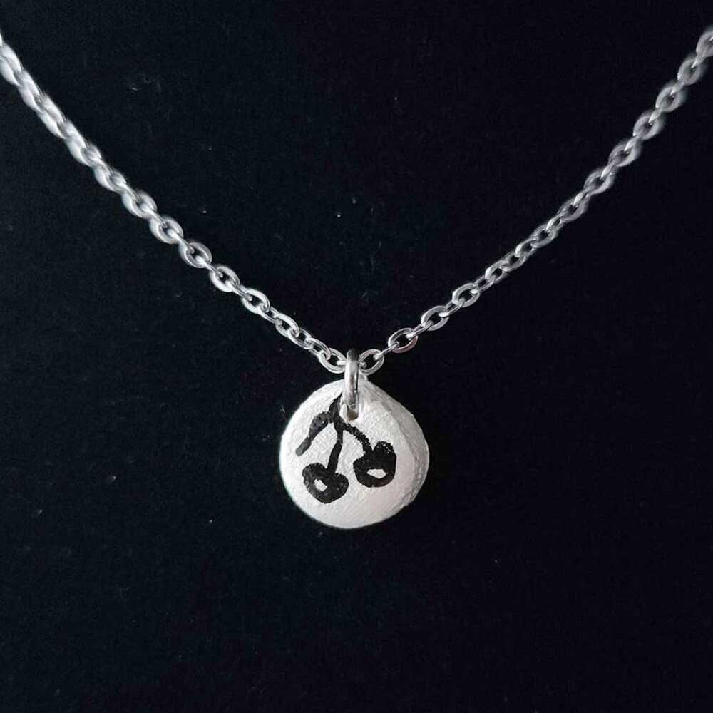 Dainty mini black cherry necklace with a small silver chain